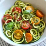 Raw Spiralized Zucchini Noodles with Tomatoes and Pesto