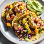 Spicy Shrimp Tacos with Mango Slaw and Avocado Crema