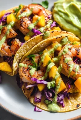Spicy Shrimp Tacos with Mango Slaw and Avocado Crema